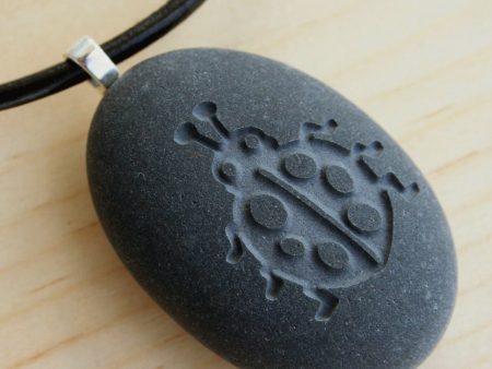 Ladybug pendant with cord - Tiny PebbleGlyph (C) - Engraved beach stone necklace Online now